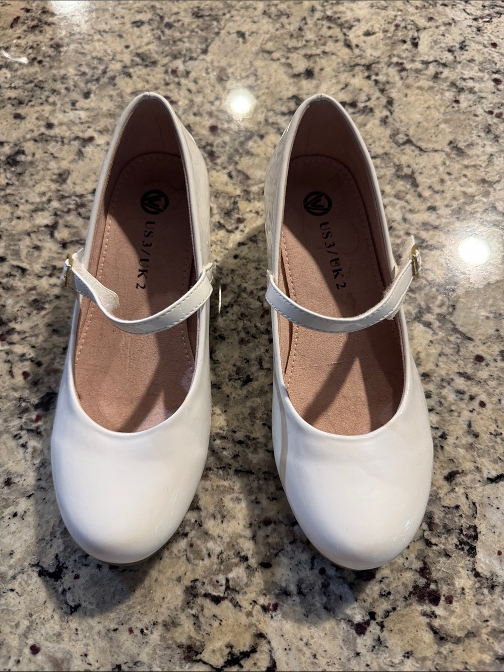 White patent girls Mary Jane shoes